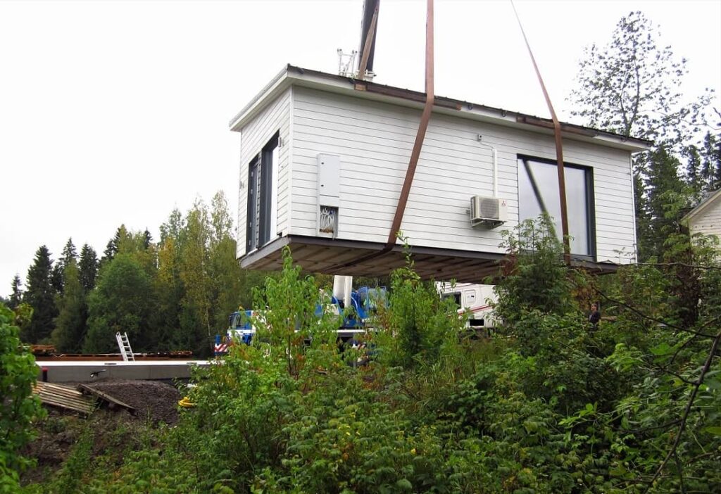 house being lifted on its foundation with a crane