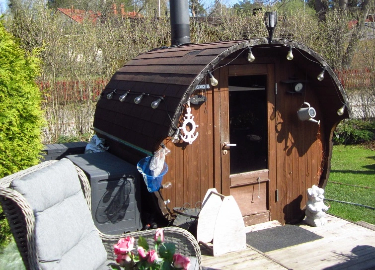 barrel sauna behind a chair