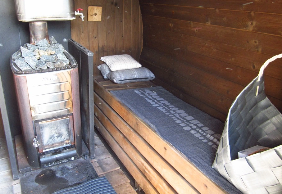 barrel sauna with long sauna bench