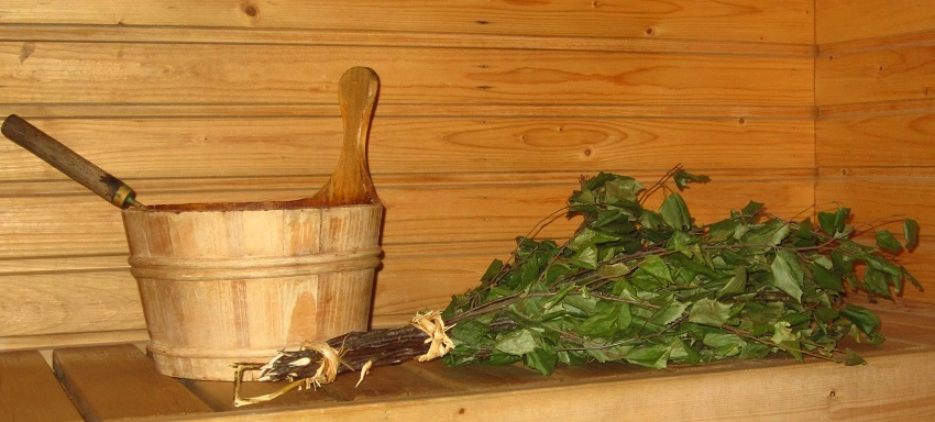 water bucket and sauna whisk on sauna bench