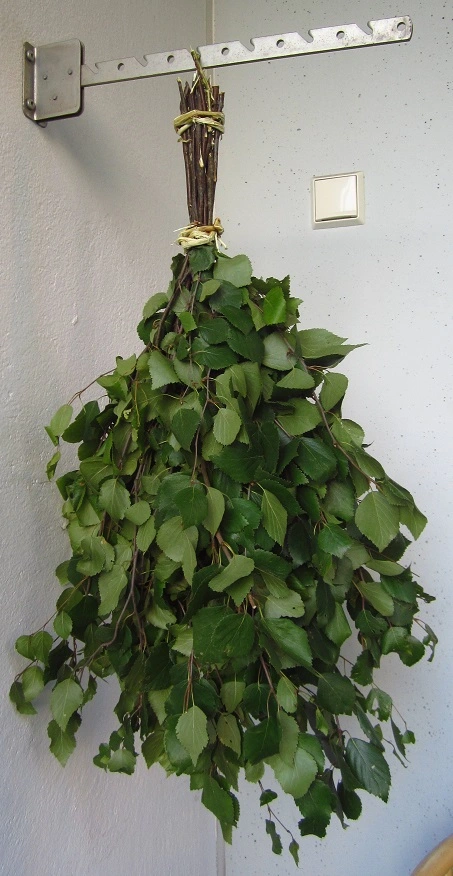 sauna whisk hanging on balcony