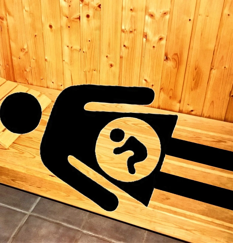pregnant woman lying on sauna bench