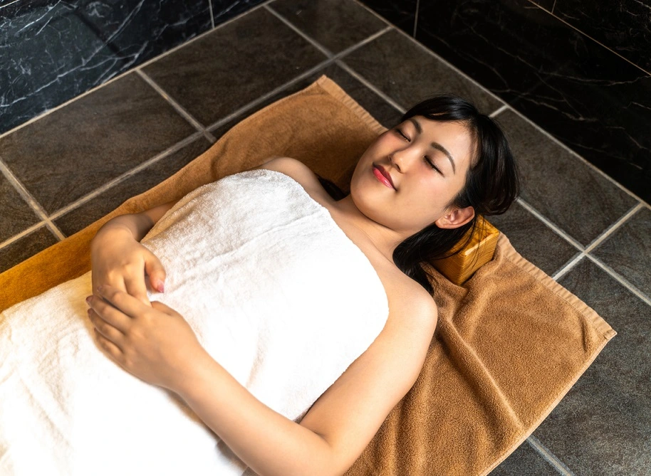 woman lying down and relaxing in a spa