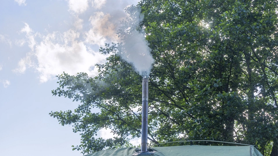 sauna tent chimney with smoke coming out