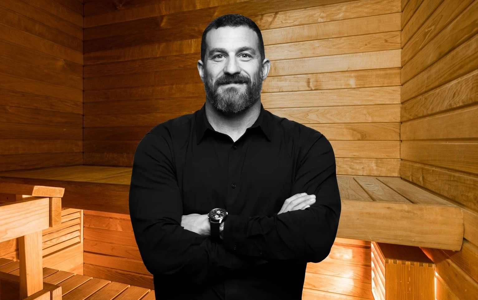 Huberman's sauna pose in front of sauna benches