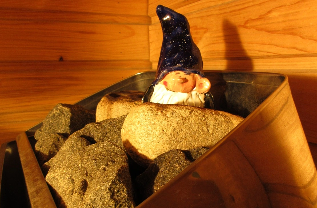 ceramic sauna elf on sauna rocks