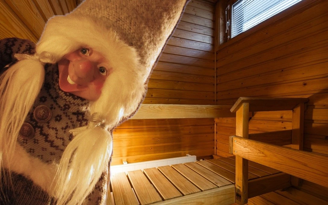 sauna elf in front of sauna benches
